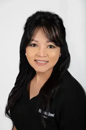 Janice, dental professional at Las Vegas practice on Hualapai Way, smiling portrait.