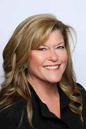Jen, dental team member at Las Vegas practice on Hualapai Way, smiles for professional portrait.