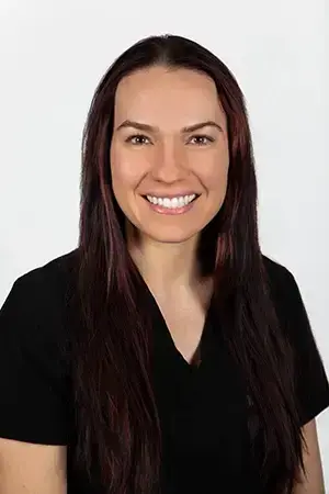 Nichole, dental team member at Las Vegas practice, smiling at camera.