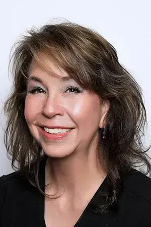 Wendee, dental professional at Las Vegas practice on Hualapai Way, smiling portrait.