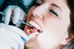 Dentist performing root canal treatment on patient in Las Vegas dental office.