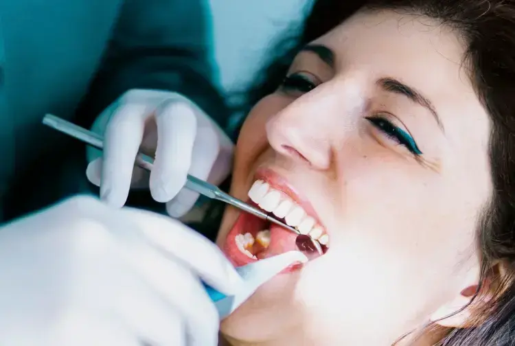 Patient receiving root canal treatment from dentist in Las Vegas.